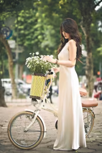 VGU No.54: Elegant Vietnamese Girl with White Chrysanthemums, A Gentle Moment by Bicycle Amidst Greenery.-3
