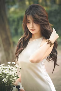 VGU No.54: Elegant Vietnamese Girl with White Chrysanthemums, A Gentle Moment by Bicycle Amidst Greenery.-7