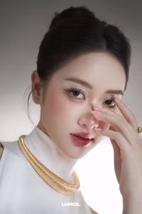 VGU No.53: Elegant beauty in a pristine white dress, posing glamorously on a luxurious black chair. Explore the sophisticated style of the modern woman.-10