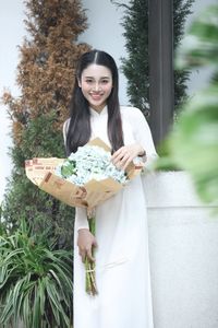 Elegant Vietnamese Ao Dai Beauty Amidst Vibrant Flower Market: Youthful Charm-2