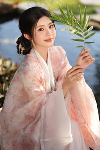 Explore East Asian Traditional Beauty: An Elegant Muse in Soft Pastel Attire.-0