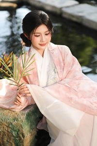 Explore East Asian Traditional Beauty: An Elegant Muse in Soft Pastel Attire.-8