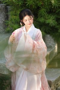 Explore East Asian Traditional Beauty: An Elegant Muse in Soft Pastel Attire.-6