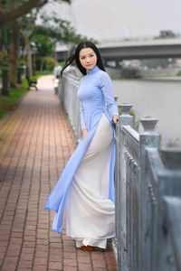 XVG No.4: Graceful Vietnamese Ao Dai Beauty by the River - Captivating Traditional Elegance-5