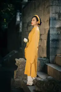 Discover the Graceful Beauty of a Vietnamese Woman in Radiant Yellow Ao Dai with Pure Lotus 1000025235-4