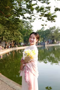 VGU No.148: Radiant Smile in Traditional Ao Dai: Elegant Vietnamese Beauty by the Lake.-1