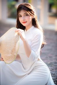 Graceful Vietnamese Girl in Pristine White Ao Dai: Timeless Beauty.-5