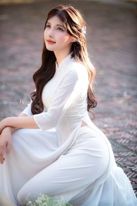 Graceful Vietnamese Girl in Pristine White Ao Dai: Timeless Beauty.-6