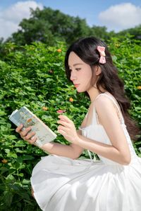 Elegant Young Woman in White Dress Amidst Greenery | Natural Summer Beauty-6