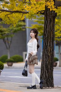 Young Asian Girl in Plaid Skirt Embracing Autumn Foliage-8