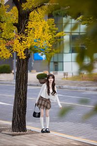 Young Asian Girl in Plaid Skirt Embracing Autumn Foliage-11