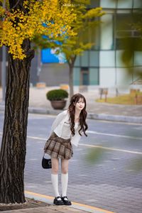 Young Asian Girl in Plaid Skirt Embracing Autumn Foliage-20