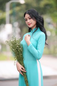 Vietnamese Ao Dai Beauty: Graceful Girl with Flowers.-2