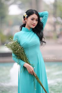 Vietnamese Ao Dai Beauty: Graceful Girl with Flowers.-9