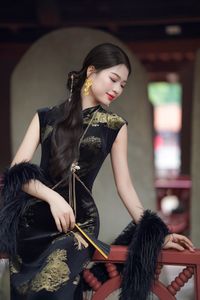 Captivating Asian Beauty in an Elegant Black Velvet Cheongsam-2