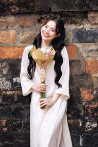 VGU No.131: Graceful young woman in traditional dress, timeless Vietnamese beauty against ancient brick.-7