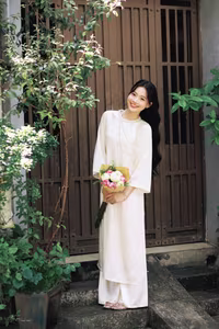 VGU No.131: Graceful young woman in traditional dress, timeless Vietnamese beauty against ancient brick.-2