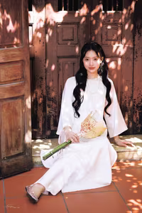VGU No.131: Graceful young woman in traditional dress, timeless Vietnamese beauty against ancient brick.-9