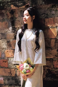 VGU No.131: Graceful young woman in traditional dress, timeless Vietnamese beauty against ancient brick.-10