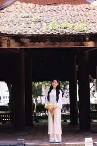 VGU No.131: Graceful young woman in traditional dress, timeless Vietnamese beauty against ancient brick.-12