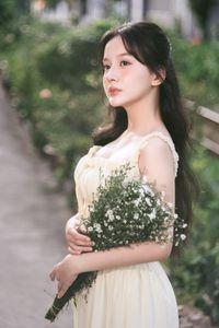 Graceful Girl in Light Yellow Dress with White Flowers, Ethereal Beauty in Nature-4