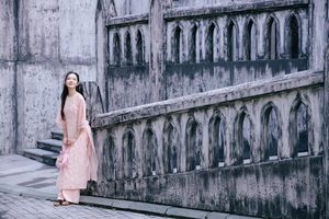 Elegant Woman in Pink Ao Dai at Hanoi Grand Cathedral - Vietnamese Cultural Charm-12