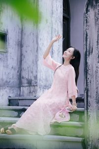 Elegant Woman in Pink Ao Dai at Hanoi Grand Cathedral - Vietnamese Cultural Charm-2