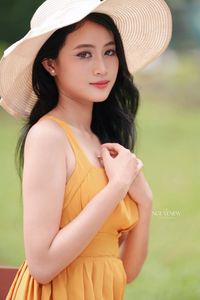 Charming Girl in Yellow Dress with Wide-Brim Hat Outdoors-6