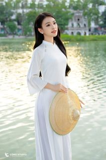 Gentle Vietnamese Woman in White Ao Dai by Hoan Kiem Lake | Serene Beauty of Vietnam-6