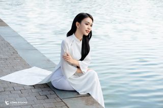 Gentle Vietnamese Woman in White Ao Dai by Hoan Kiem Lake | Serene Beauty of Vietnam-1