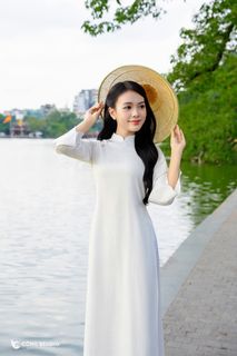 Gentle Vietnamese Woman in White Ao Dai by Hoan Kiem Lake | Serene Beauty of Vietnam-5