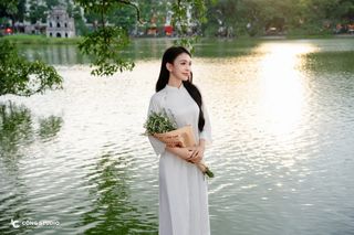 Gentle Vietnamese Woman in White Ao Dai by Hoan Kiem Lake | Serene Beauty of Vietnam-4
