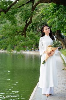 Gentle Vietnamese Woman in White Ao Dai by Hoan Kiem Lake | Serene Beauty of Vietnam-7