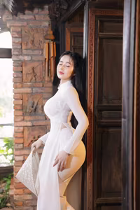 VGU No.108: Pristine White Ao Dai Elegance A Graceful Vietnamese Woman in Traditional Setting-3