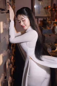 VGU No.108: Pristine White Ao Dai Elegance A Graceful Vietnamese Woman in Traditional Setting-5