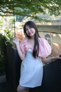Radiant smile of a young, elegant Vietnamese girl in a pink and white dress.-10