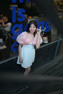 Radiant smile of a young, elegant Vietnamese girl in a pink and white dress.-4