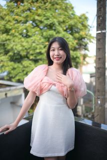 Radiant smile of a young, elegant Vietnamese girl in a pink and white dress.-13