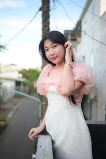 Radiant smile of a young, elegant Vietnamese girl in a pink and white dress.-2