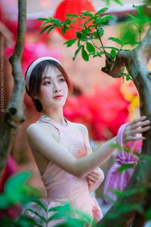 Elegant Vietnamese Beauty with Traditional Fish Lantern, Celebrating Culture-1