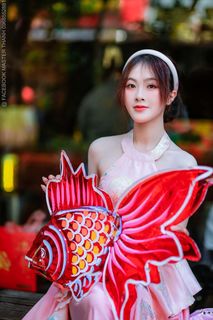 Elegant Vietnamese Beauty with Traditional Fish Lantern, Celebrating Culture-6