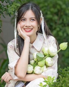 Elegant Vietnamese Woman with Pure Lotus Flowers-0