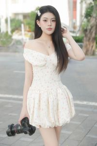 Graceful Woman in White Floral Dress Amidst Serene Summer Nature-1