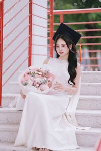 Beautiful Female Graduate Embraces Success at Graduation Ceremony-8