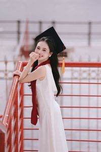 Beautiful Female Graduate Embraces Success at Graduation Ceremony-4