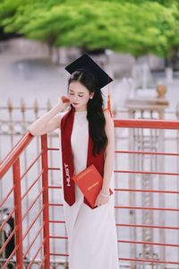 Beautiful Female Graduate Embraces Success at Graduation Ceremony-6