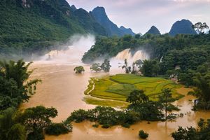 Ban Gioc Waterfall in Autumn Majestic Scenery Rushing White Waters Amidst Cao Bang Mountains-0