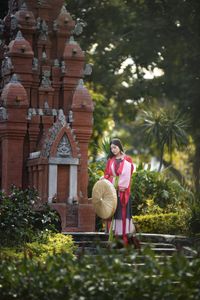Traditional Vietnamese Beauty: Young woman with ancient instrument, immersed in culture and music.-6