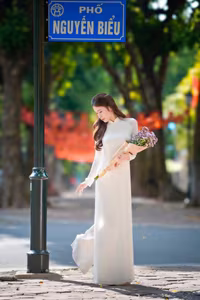 XVG No.55: Vietnamese Ao Dai Charm A Radiant Smile Embracing Youth and Tradition Under Golden Sun-8