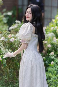 Elegant Beauty: Gentle Girl in Vintage Dress Amidst Dreamy Flower Garden-6